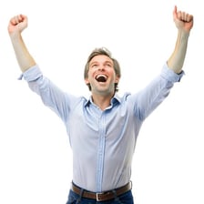 Person celebrating a win with raised arms