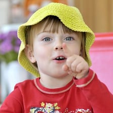 A child responding with a cheeky expression.