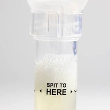 A consumer ancestry DNA testing kit with a sample tube