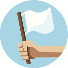 A white flag being raised as a symbol of surrender.
