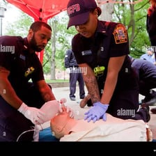 Emergency medical technicians performing CPR during a response