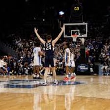 The University of Connecticut basketball team playing in an arena