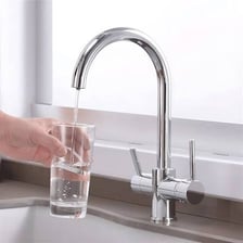 A faucet with a handle dispensing water