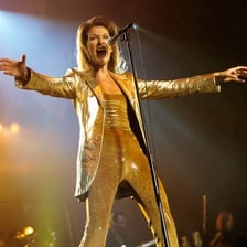 Celine Dion performing on stage.