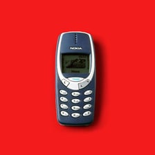 A classic Nokia brick-style mobile phone with a physical keypad.