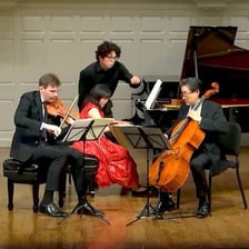 Three musicians performing as a group