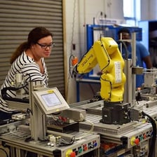 A technician operating a large machine