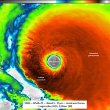 A satellite view showing the clear eye at the center of a hurricane.