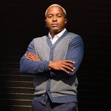 A portrait showing a masculine-presenting style