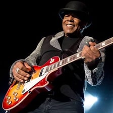 Tito Jackson performing with a guitar