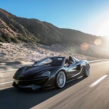 A sporty convertible car on a road