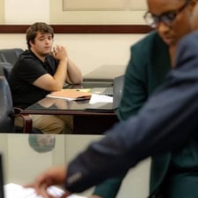 A person objecting to an accusation in a courtroom setting.