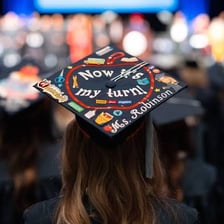 A teacher graduating with an education degree