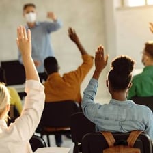 A workplace group participating in a diversity and sensitivity-training session.