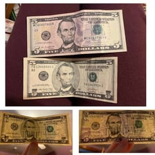 A ten-dollar bill beside two five-dollar bills.