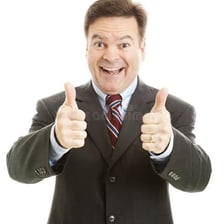 A person enthusiastically giving a thumbs-up gesture