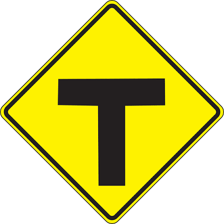 A road intersection with directional signs.
