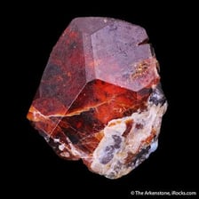 A rough rock specimen containing visible iron ore.
