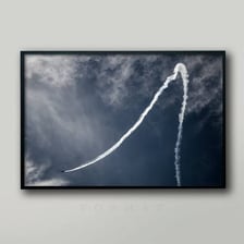 An airplane leaving a visible contrail across the sky
