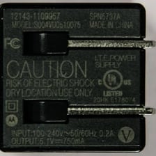 Electrical charger showing a voltage specification