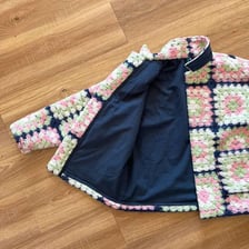 The smooth inner lining visible inside an open jacket