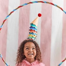 A colorful cone-shaped paper party hat.