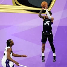 Utah Jazz players competing in a basketball game.