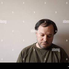 A person sitting sadly and moping