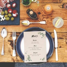 Printed menu resting on a restaurant table