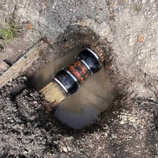 Water slowly seeping through soil.