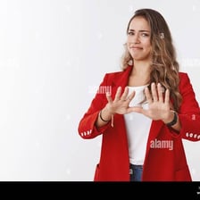 A person making a reluctant refusal gesture