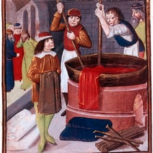 A textile worker handling fabric near a dyeing vat.