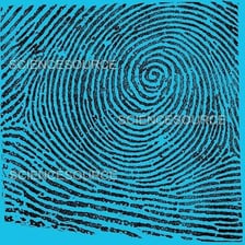 A close-up fingerprint showing a circular whorl pattern.