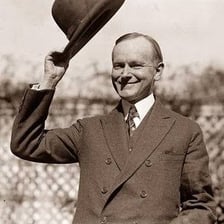 A person tipping a hat in greeting