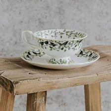 A cup of tea served on a saucer