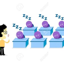 An audience appearing bored during a lecture.