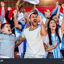 A sports fan cheering in support of a team