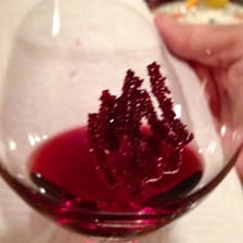 Crystalline wine tartar sediment collected in a bottle
