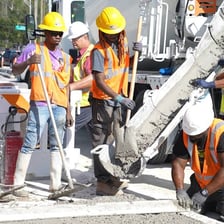 A group of workers gathered at a construction site.