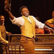 Actors performing prominently in a theater production.