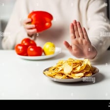 A person deliberately avoiding an unwanted food.