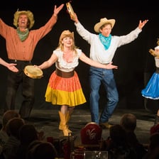 Performers presenting a short comedy sketch onstage