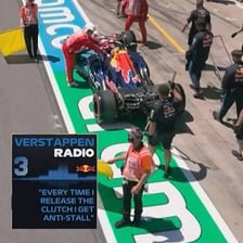 Race car receiving service in a pit lane