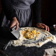 Semolina flour made from durum wheat beside pasta.