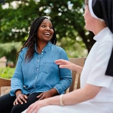 A spiritual teacher speaking with a student.