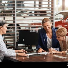 A sales professional working at a desk.