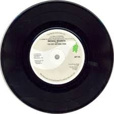 An extended-play vinyl record displayed beside a single