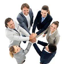 A group of people standing together as a unified team