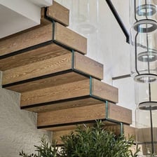 A staircase forming a flight of stairs between two floors