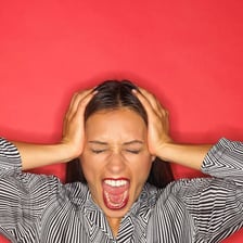 An annoyed person reacting to an irritating situation